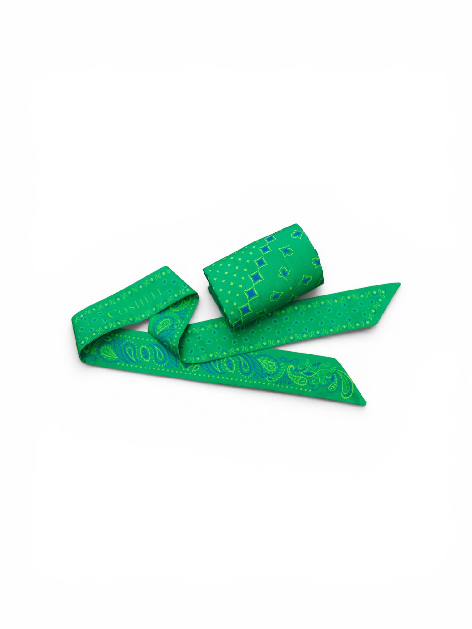 A green cotton twilly scarf and rolled up body bandana sarong with a light green paisley pattern, folded and displayed on a clean white background.