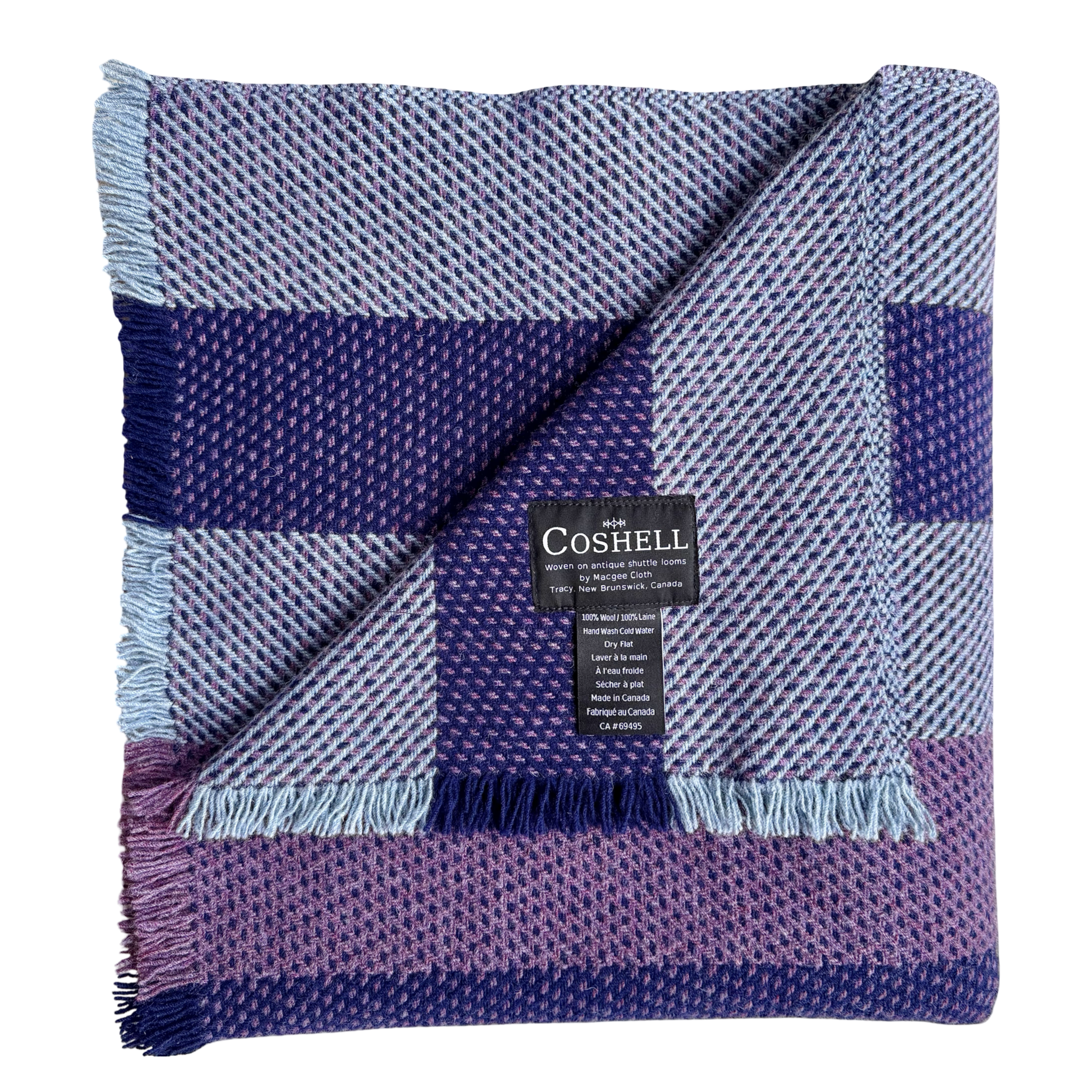 A folded woven throw blanket by Coshell, featuring a plaid pattern in shades of purple, blue, and lavender with light blue fringe, shown on a white background.