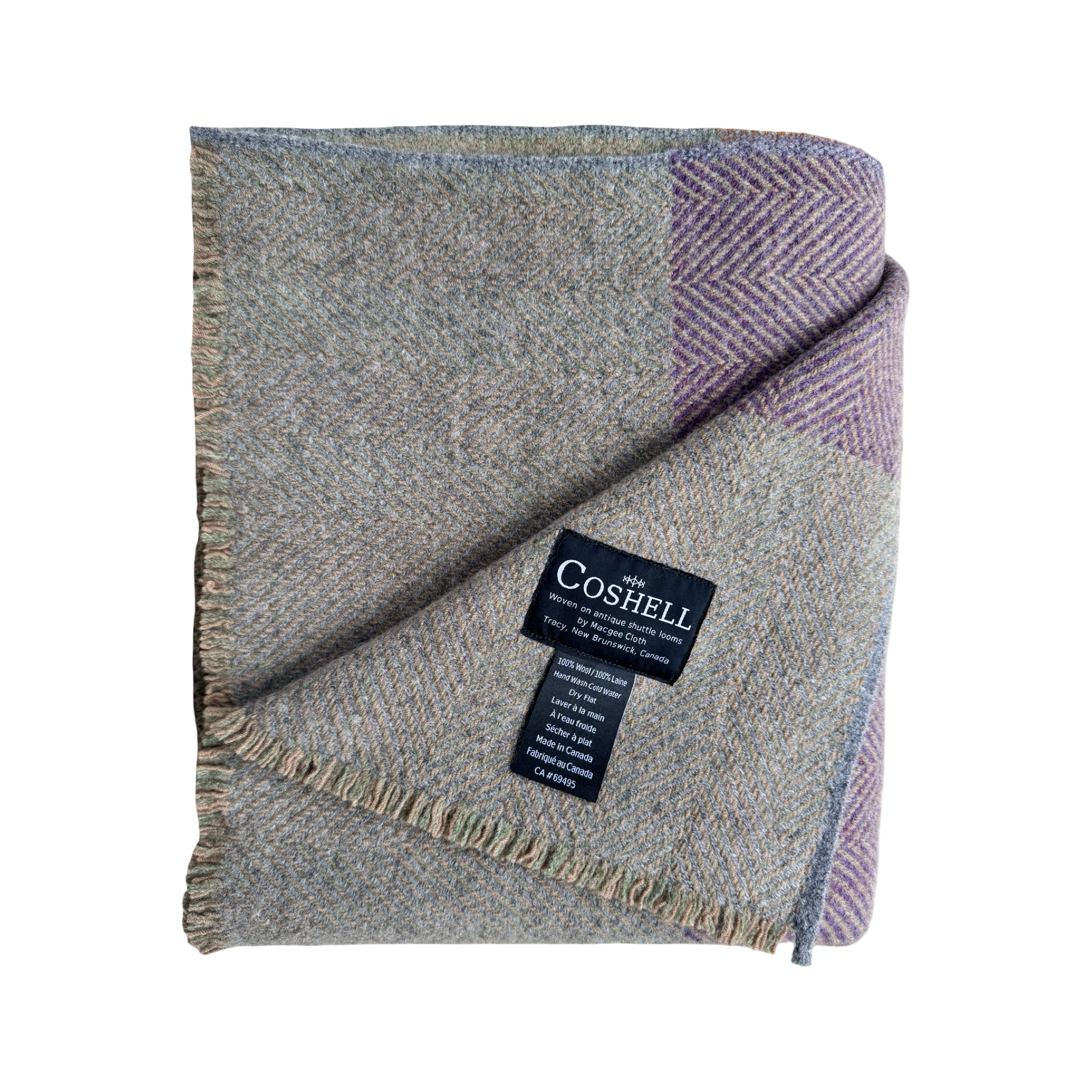 A folded wool blanket with a textured herringbone pattern in gray, beige, tuscan orange and purple, featuring a black Coshell brand label.